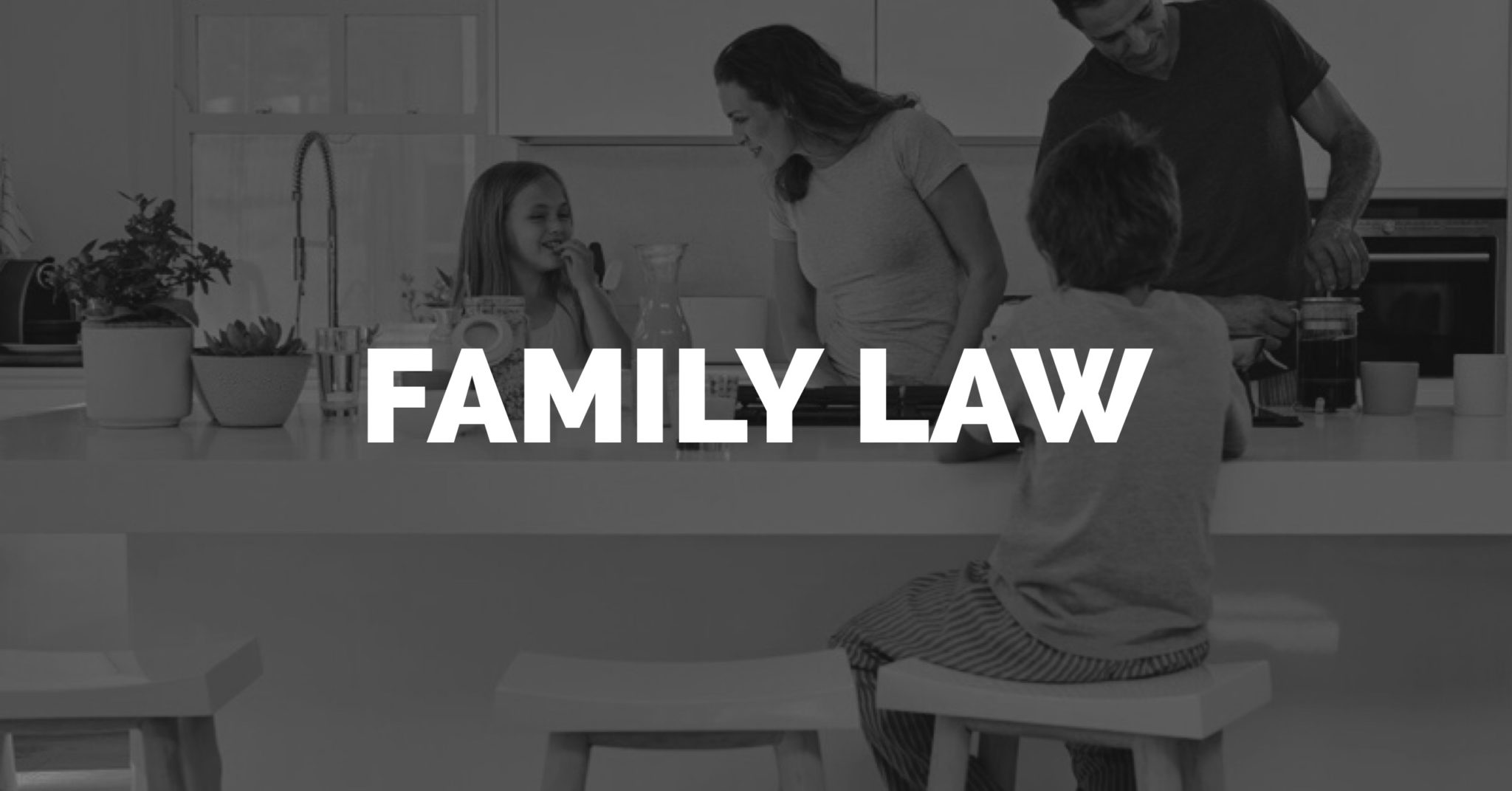 Family Attorneys Tampa FL family surrounding island in kitchen 